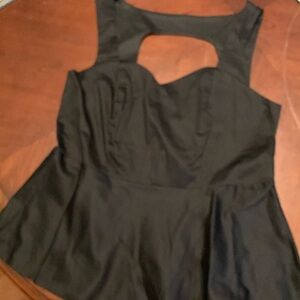 Torrid size 2 peplum black sateen top. Sweetheart neckline, back cutout. NWT.